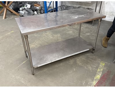 Commercial-grade stainless steel work table featur...