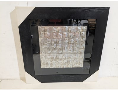 Modern wall-mounted display  featuring a black woo...