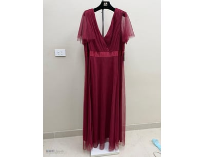 BURGUNDY TULLE EVENING GOWN WITH DRAPED CAPE SLEEV...