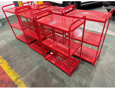 Lot of red powder-coated steel utility shelving un...