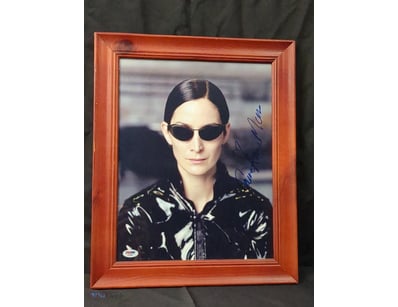 THIS IMAGE FEATURES A FRAMED, AUTOGRAPHED PHOTOGRA...