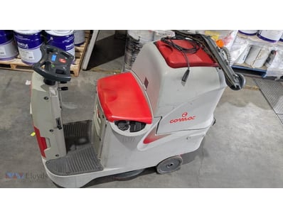 Comac Innova 55B ride-on floor scrubber in cream a...