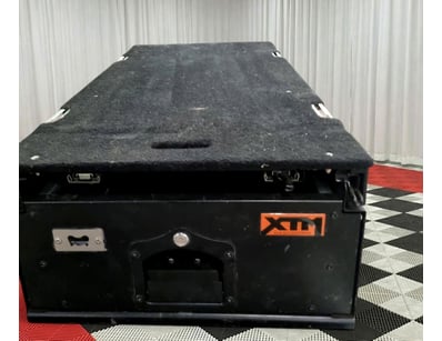 XTM brand tool storage box featuring robust black ...