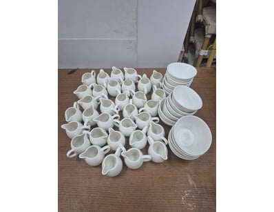 Lot of small milk jugs and small ceramic bowls.

S...