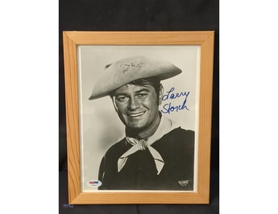 AUTOGRAPHED PHOTOGRAPH OF LARRY STORCH.

Item Size...