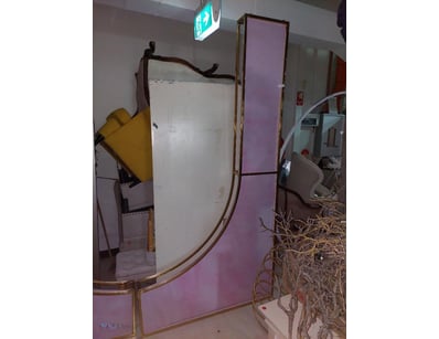 Vintage wooden-framed mirror with decorative carve...