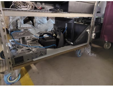 Mobile AV equipment rack on castors containing pro...