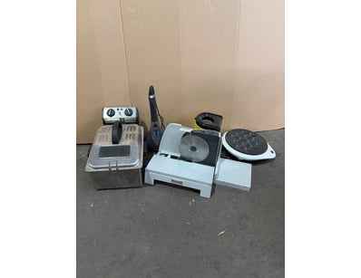 Vintage kitchen appliance collection featuring a C...