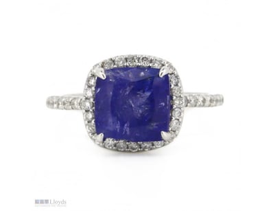 14K WHITE GOLD, TANZANITE AND DIAMOND, HALO RING. ...