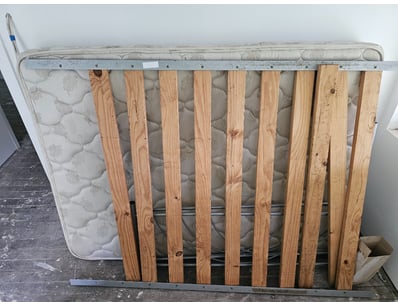 Metal bed frame with wooden slats and mattress

Lo...