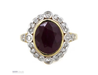 14K YELLOW GOLD, RUBY AND DIAMOND, HALO RING.     ...