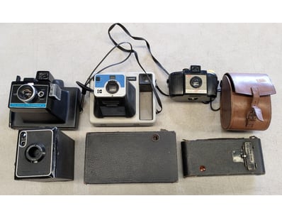 COLLECTION OF SIX FILM AND POLAROID CAMERAS

Inc...