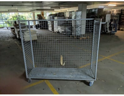 Industrial galvanised steel security cage on casto...