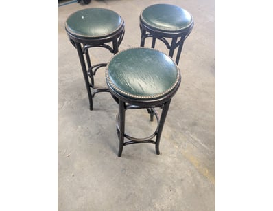 Set of three bar stools featuring black-stained ti...
