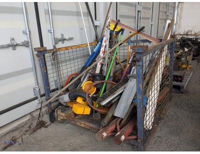 Cage of mixed tools, Post Rams, shovels, first aid...