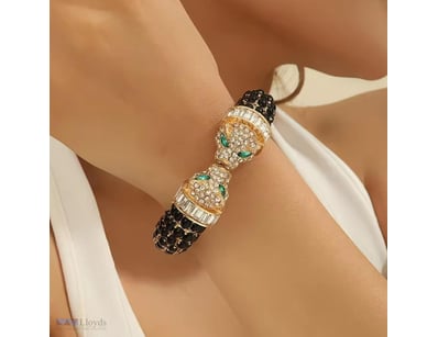 BLACK AND GOLD RHINESTONES SNAKE BANGLE        

C...