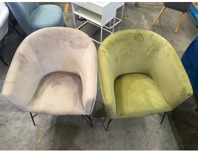 Pair of modern accent chairs featuring curved, bar...