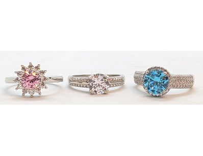 THREE SILVER COLOURED STONE RINGS

Size: All Size ...