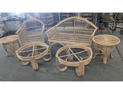 Rattan lounge setting comprising a two-seater sofa...