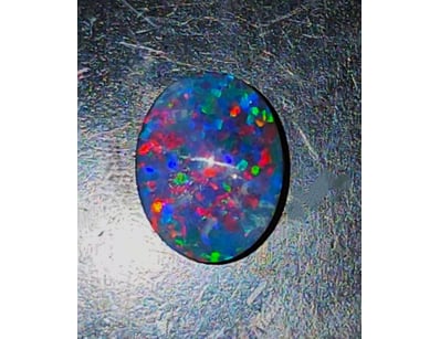 1.3 CARATS BLACK OPAL TRIPLET.    

Dimensions: 8 ...