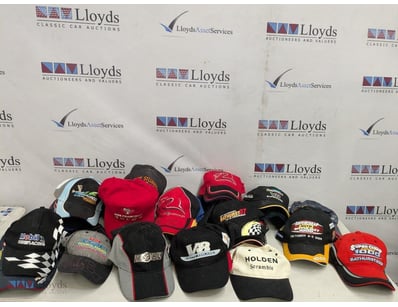 COLLECTION OF SIGNED MOTORSPORT RACING CAPS AND HA...