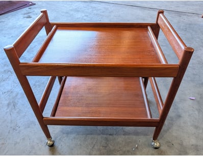 Vintage two-tier wooden serving cart featuring sol...