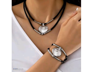 STAINLESS STEEL AND BLACK CORD NECKLACE WITH BRACE...