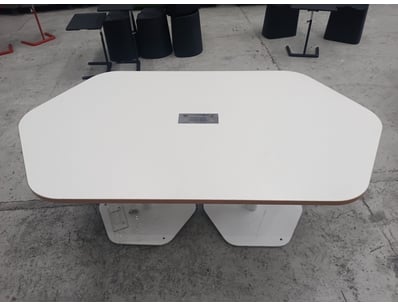 Modern white conference table with rounded rectang...