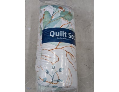Botanical-patterned quilt set featuring eucalyptus...