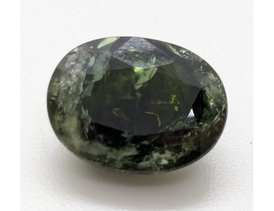 4.15CT OVAL CUT GREEN TOURMALINE

655266+74

...
