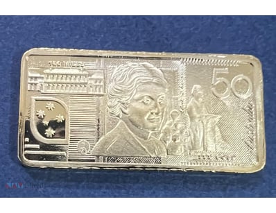 YOU WILL RECEIVE 2014- 5 GRAM GOLD PLATED $50 DOLL...