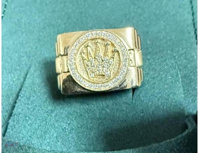 ROLEX YELLOW GOLD AND DIAMOND RING      

Includes...