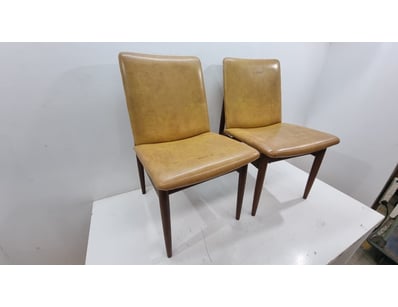 Pair of mid-century modern dining chairs featuring...