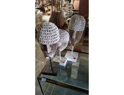 Set of three decorative wooden head sculptures fea...