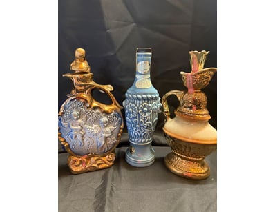TRIO OF DECORATIVE PORCELAIN DECANTERS

SOLD AS LO...