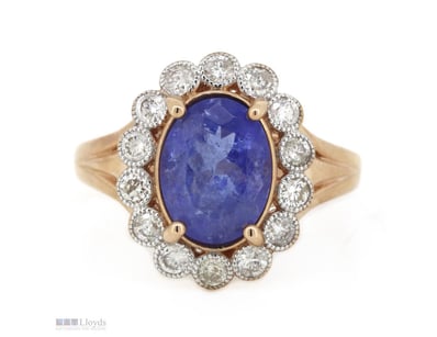 14K ROSE GOLD, TANZANITE AND DIAMOND, HALO RING.  ...
