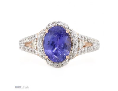 14K ROSE GOLD, TANZANITE AND DIAMOND, HALO RING.  ...