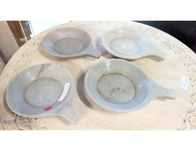 Set of four marble bowls with integral handles, fe...