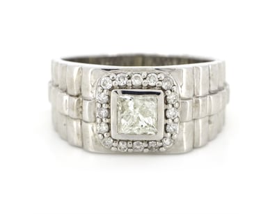 14K WHITE GOLD AND DIAMOND, GENTS RING.      

The...