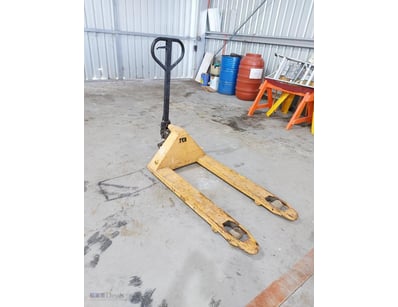 Manual pallet jack with yellow steel base and blac...