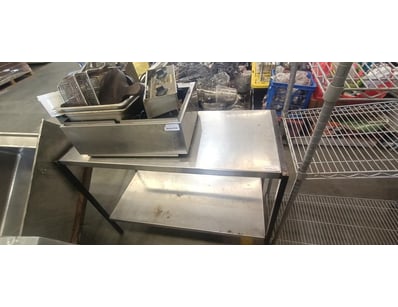 Metal table with fryer and fryer accessories

Ap...