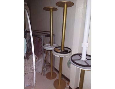 Modern pedestal table featuring a white marble-eff...
