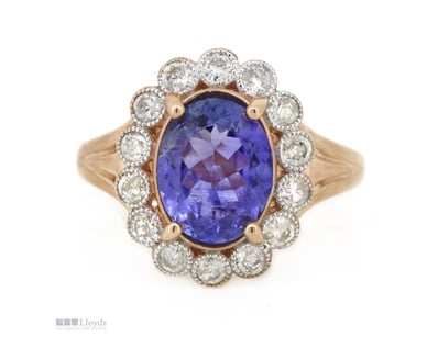 14K ROSE GOLD, TANZANITE AND DIAMOND, HALO RING.  ...