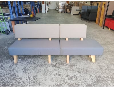 Modern modular sofa bed featuring a two-section de...