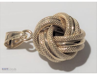 9CT GOLD TEXTURED KNOT PENDANT     

Marked 375 & ...