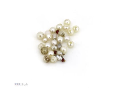 12.43CT TSW, NATURAL PEARLS DRILLED       

Valuat...