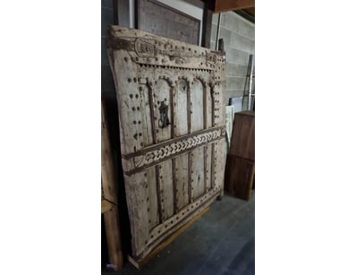 Antique Door featuring a distinctive design with w...