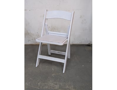 Foldable white plastic chairs with padded seating...
