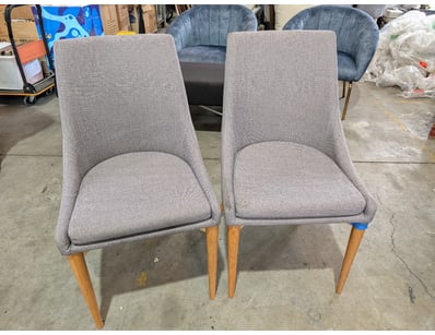 Pair of dining chairs featuring grey upholstered s...