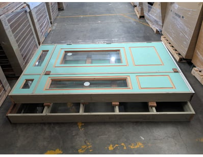 Two timber doors, pale blue exterior, door and pan...